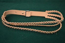 A Swarovski crystal and leather necklace, boxed.