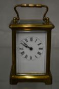 A brass carriage clock.