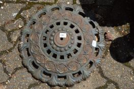 A cast iron parasol stand (base only).