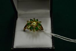 A gold cluster ring, size U.