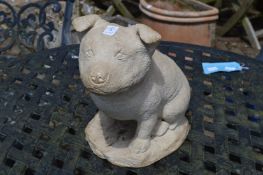 A reconstituted stone model of a dog.