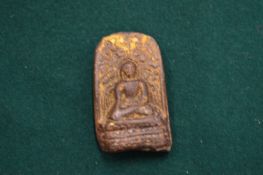 A small hard stone Buddha.