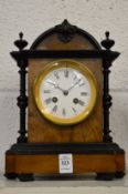 A Victorian walnut cased mantel clock.