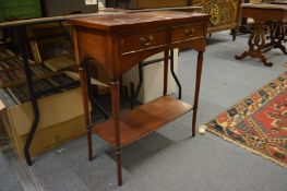 A small mahogany two drawer two-tier occasional table.