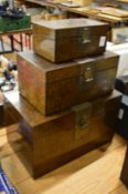 Graduated set of three Chinese storage boxes.