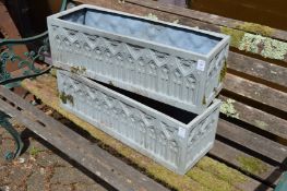 A pair of faux lead rectangular planters.