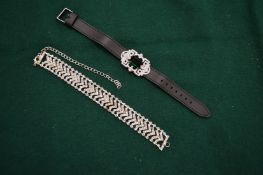 A diamante bracelet and another decorative bracelet.
