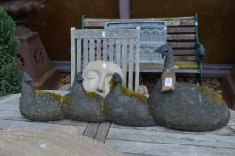 An unusual carved stone group of mother bird and three chicks.