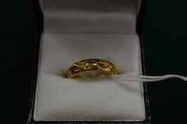 A 9ct gold engraved wedding band, size N.