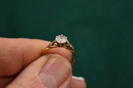 A 9ct gold and cubic zirconia ring, size R.