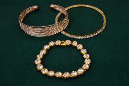 Three decorative bracelets.
