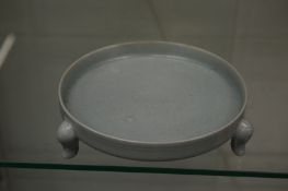 A Chinese celadon glazed circular brush washer.