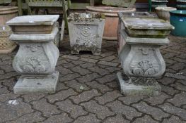 A pair of classical style reconstituted stone pedestals (faults).