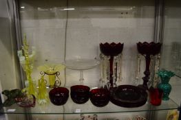 A collection of glassware to include a Vaseline glass epergne, engraved glass tazza, pair of lustres