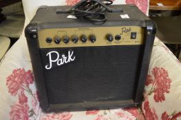 A small amplifier and an Amstrad monitor.