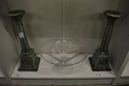 A pair of pottery candlesticks and a glass pedestal bowl.