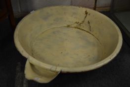 A large cream separating dish.
