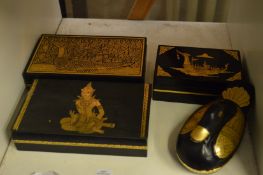 A group of four Thai lacquer boxes.