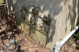 A wrought iron garden gate.