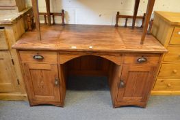 An unusual pine knee-hole desk.
