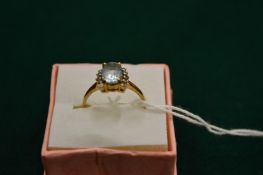 A 9ct gold, cubic zirconia and blue stone ring, size N.