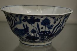 A Chinese blue and white bowl with shaped rim.