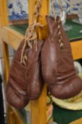 A pair of old boxing gloves.
