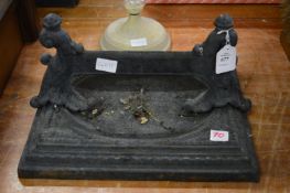 A cast iron boot scraper.