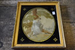 A 19th century silk work embroidered picture depicting a mournful lady beneath a tree with a dog