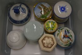 A group of porcelain boxes.