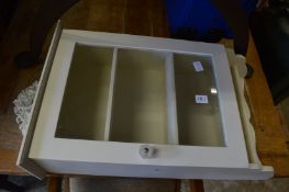 A painted hanging cabinet.