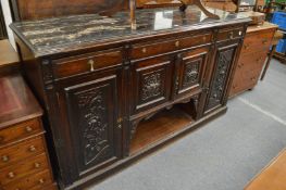 A large marble top sideboard.