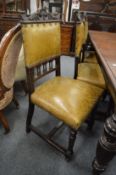 A set of six Victorian walnut and leather upholstered dining chairs.