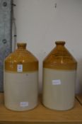 Two stoneware flagons, one for Mealds & Cooper Wine Merchants, Guildford, the other for Friary,