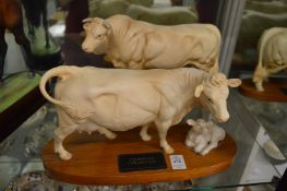 A Beswick Connoisseur model of a Charolais cow and calf together with a companion piece of a