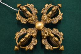 An Eastern bronze double vajra.