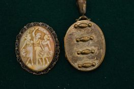 A cameo brooch and a Victorian locket.