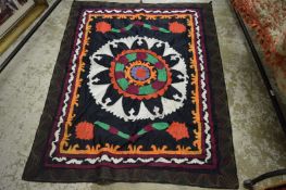 A decorative Eastern embroidered throw.