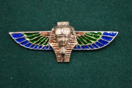 An Egyptian revival brooch.