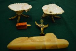 A pair of shell dishes, carved alabaster model of a sphinx and two other pieces.