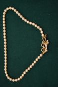 Decorative pearl necklace, boxed.