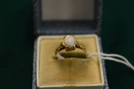 A 9ct gold and opal ring, size L.