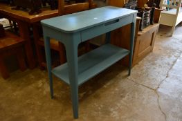 A light blue painted single drawer two-tier side table.