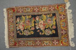 Two small Persian mats 80cm x 52cm and 74cm x 61cm.