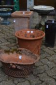 Four various terracotta planters, various shapes.