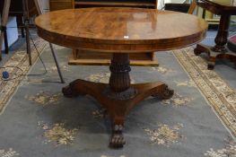 A good Regency rosewood circular tilt-top breakfast table on turned and carved central column