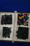 Four boxes of coloured stones.