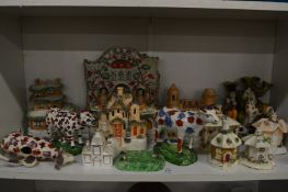 A collection of Staffordshire items to include a large pocket watch holder, pastel burners, vases