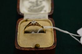 A 9ct gold and diamond ring, size R.