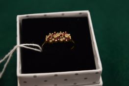 A 9ct gold, ruby and diamond ring, size T.